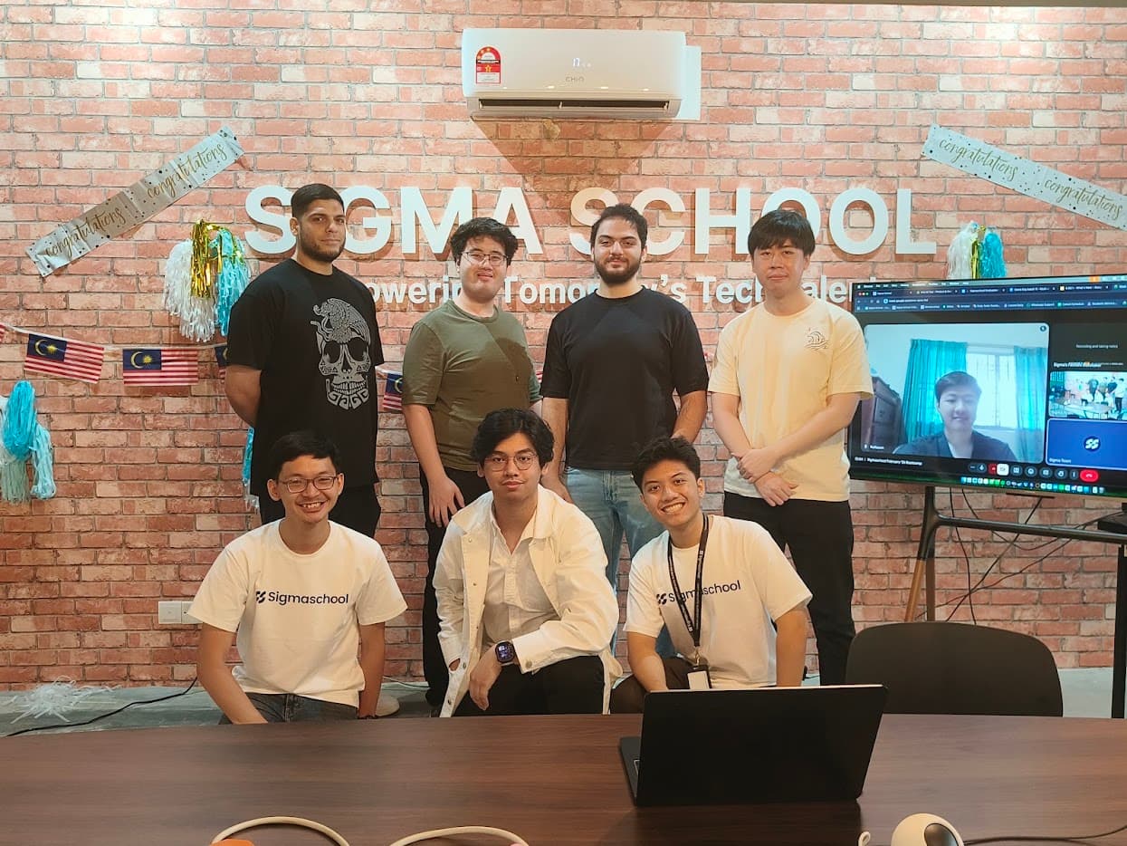 Sigmaschool Batch 11 graduation - students in the studio with a remote classmate on the video wall
