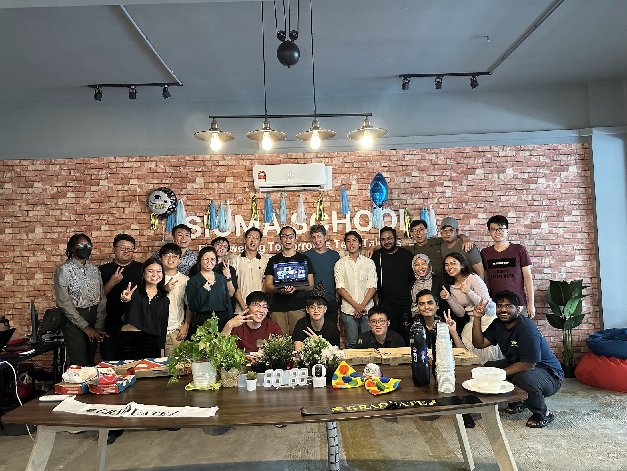 A Sigmaschool cohort celebrating on graduation day